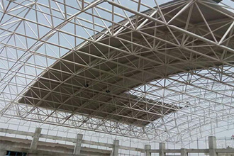 What are the performance advantages of steel space frames?