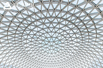 What type of glass should be used to build a dome in a cold area?