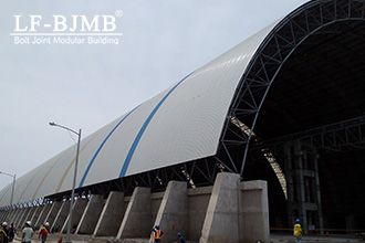 What factors contribute to damage in bolted sphere truss structures?