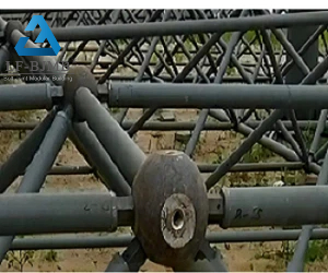 Close-up of bolt ball steel structure nodes with inadequate anti-corrosion coating. Inferior single-layer primer without hot-dip galvanizing causes rapid rusting in coastal and mining storage sheds, shortening structural service life and raising long-term maintenance costs.