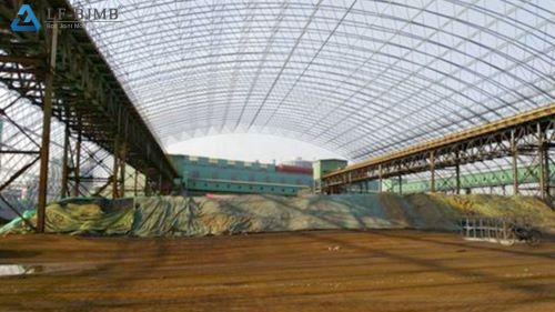 Ore Storage Shed Interior with Belt Conveyors Interior of barrel arch bolted space frame ore storage shed, with belt conveyor galleries and ore stockpile