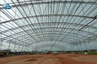 What factors influence the cost of large steel structure buildings?